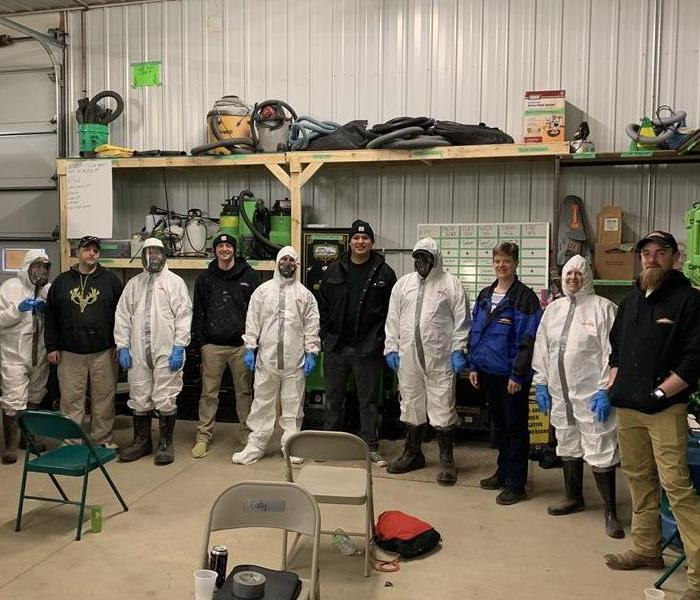 SERVPRO Staff wearing protective suits