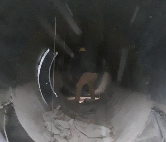 SERVPRO employee performing duct cleaning