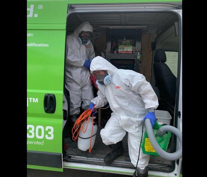 SERVPRO employees in hazmat suits ready for viral pathogen cleaning