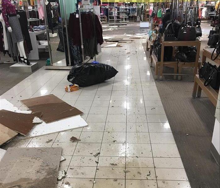 ceiling tiles on the floor of a department store after the tornado