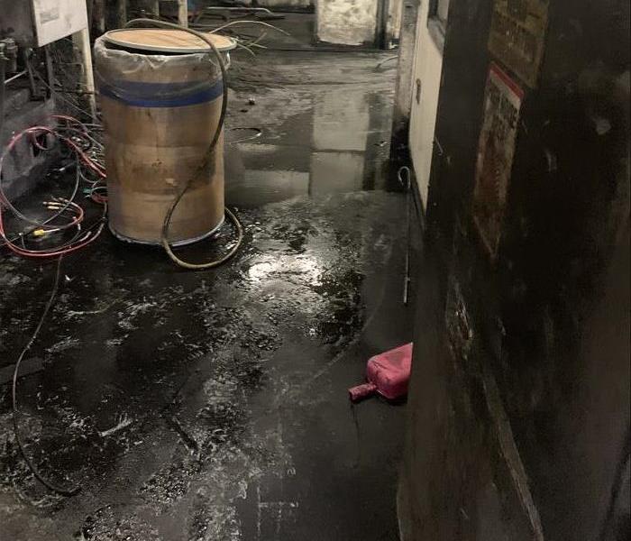 Water mixing with debris on machine shop floor