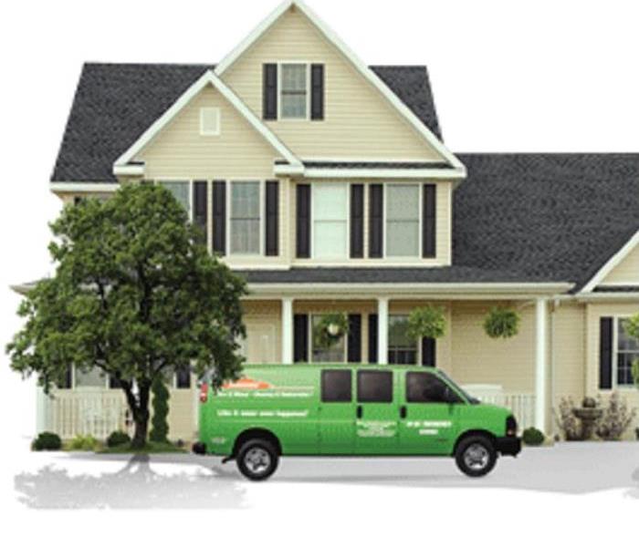 SERVPRO Green Vehicle in Front of Home